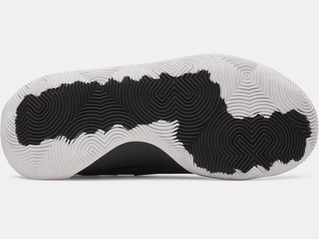 Semelle extérieure noire et blanche des Espadrilles UA Jet '25 - Under Armour pour enfant, vue de dessous détaillée.