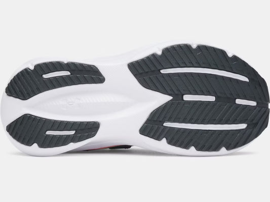 Semelle extérieure noire et blanche avec détails en caoutchouc de traction pour Espadrilles UA Charged+ Assert 11 - Under Armour, vue de dessous.