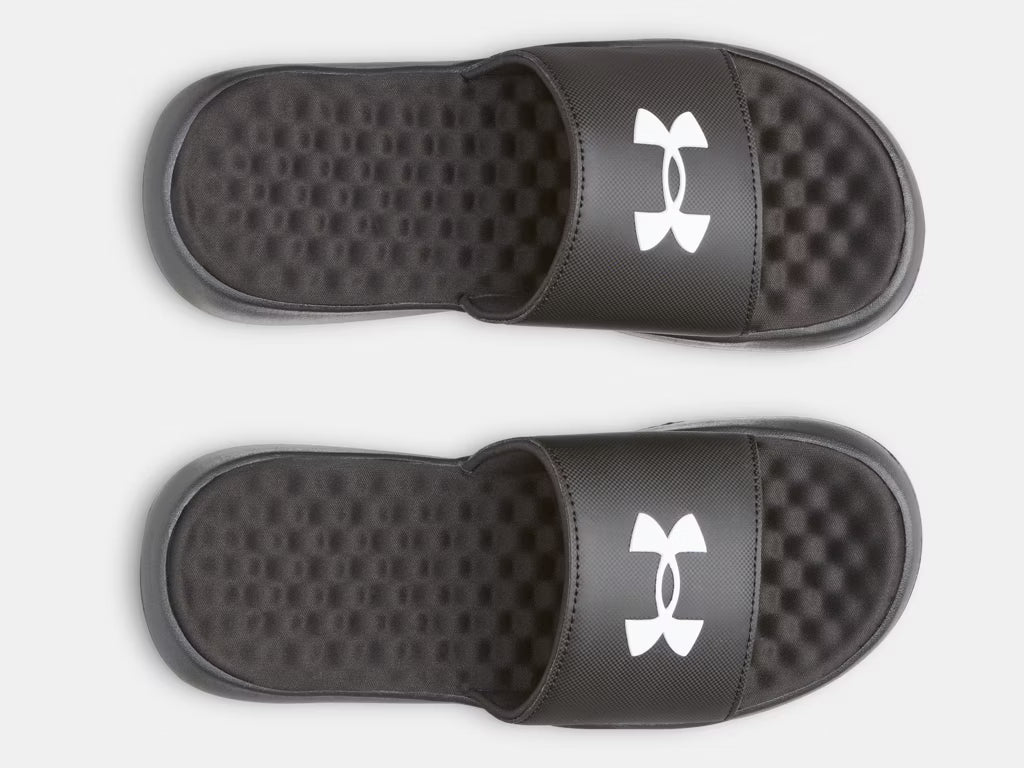 Sandales UA Ignite Pro 8 Fixed Strap - Under Armour noires avec logo blanc, style slide, pour garçon, vue de dessus.