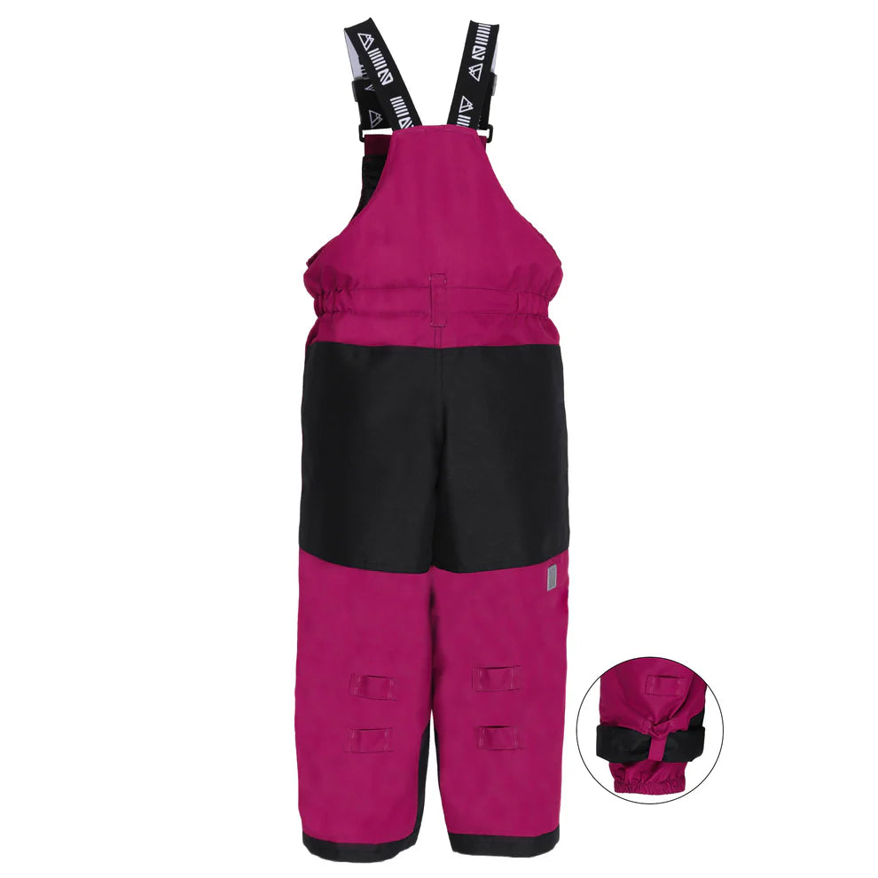 Habit de neige Anabel - Nanö bordeaux et noir, combinaison isolante pour enfant, vue de face avec détail de la fixation au bas du pantalon.