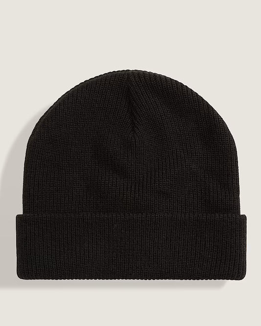 Tuque d'Hiver - Vans noire en tricot côtelé avec bord retroussé, vue de face sur fond beige.