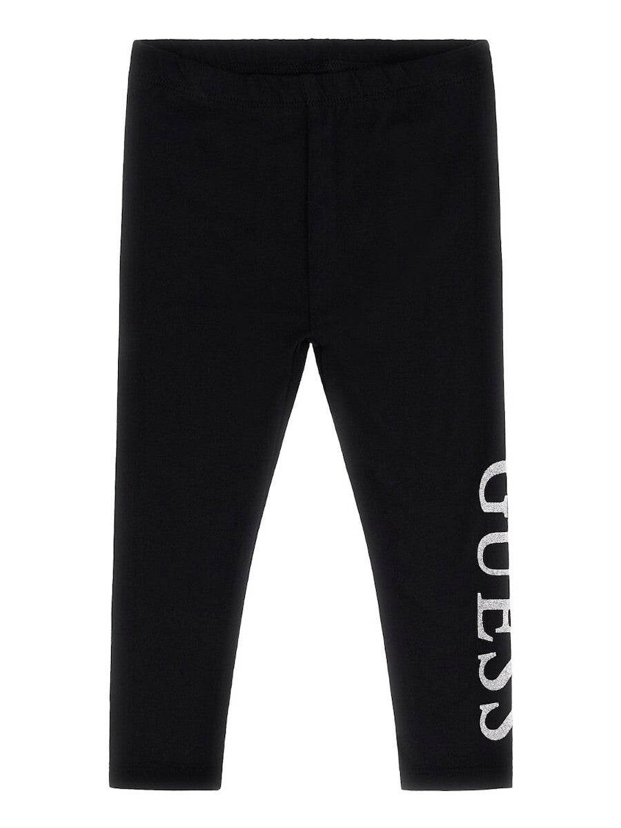 Legging - Guess noir en coton et élasthanne pour fille avec logo blanc vertical sur la jambe, vue de face.
