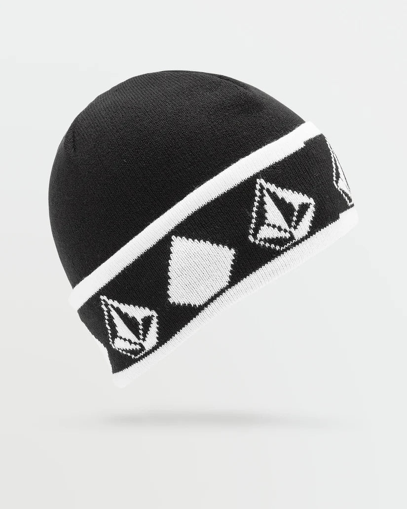Tuque d'hiver - Volcom noire et blanche avec motifs jacquard géométriques, coupe classique roulée, vue de profil.
