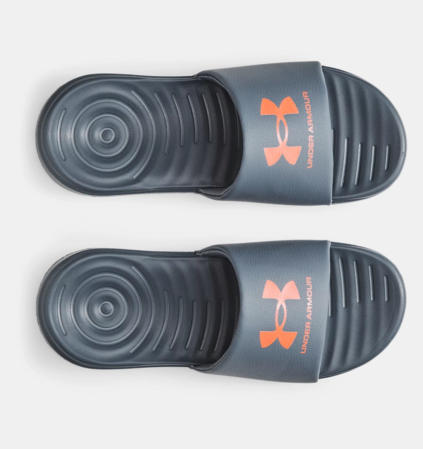 Sandales - Under Armour noires avec logo orange, style slide, semelle texturée, vue de dessus, unisexe adulte.