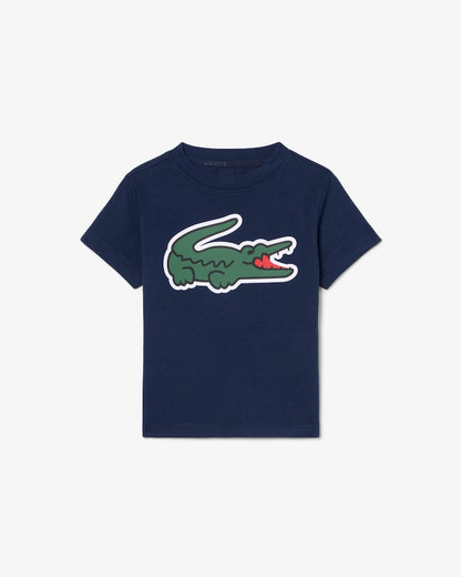 T-Shirt - Lacoste bleu marine en coton avec logo crocodile vert et rouge, pour enfant, vue de face.