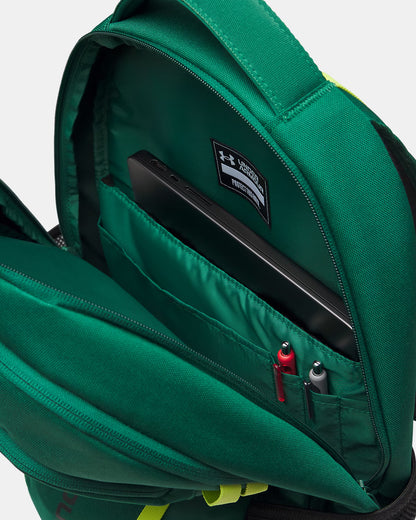 Sac à dos - Under Armour vert en polyester avec compartiment organisé pour ordinateur et stylos, vue intérieure ouverte.