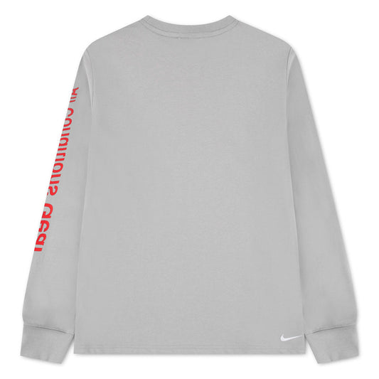 Chandail ACG Dri-FIT - Nike gris à manches longues avec inscription rouge sur la manche gauche et logo blanc au bas vue de face
