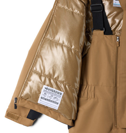 Habit de neige Buga Set - Columbia beige en tissu isolant, détail intérieur matelassé avec fermeture éclair, porté sur mannequin enfant garçon, vue de face.