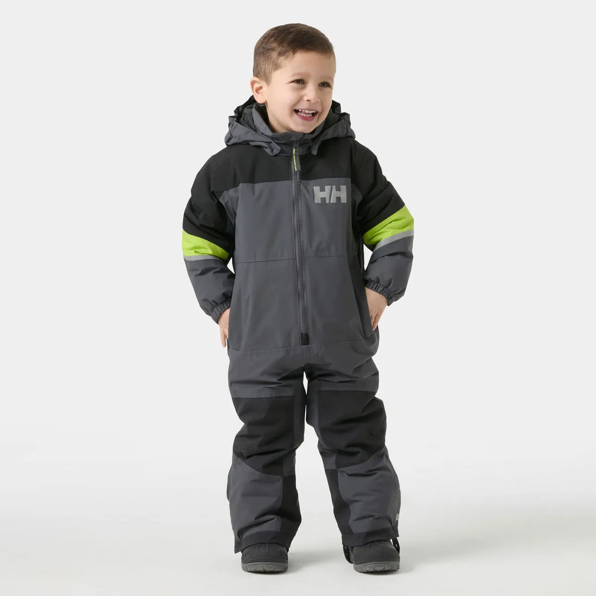 Habit de neige Rider 3.0 Insulated Snow Suit - Helly Hansen gris et noir avec accents vert lime porté par un garçon vue de face