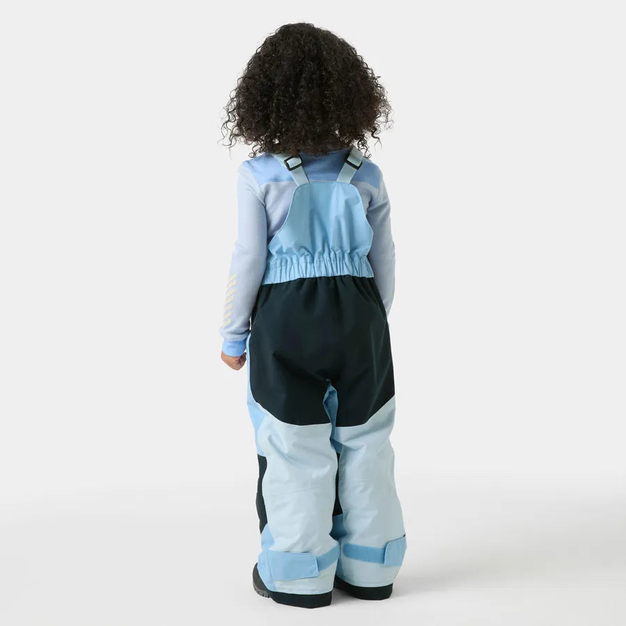 Salopette de neige Rider - Helly Hansen pour enfant, bleue et noire, vue de dos, portée par un mannequin enfant curlé