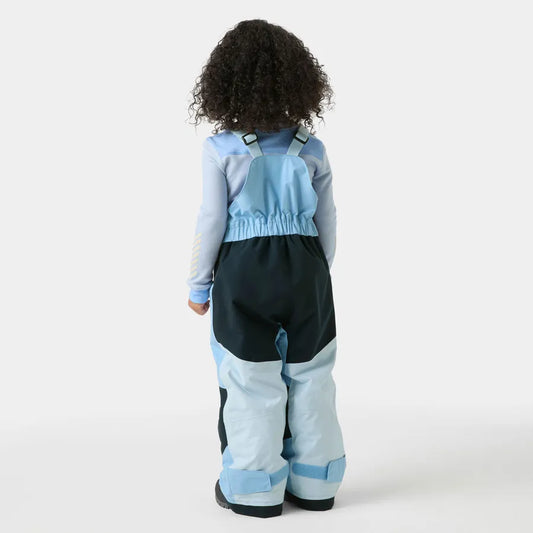 Salopette de neige Rider - Helly Hansen pour enfant, bleue et noire, vue de dos, portée par un mannequin enfant curlé