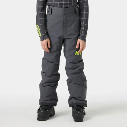 Pantalon de neige - Helly Hansen gris foncé pour enfant, poches latérales et coupe ample, vue de face porté par un modèle