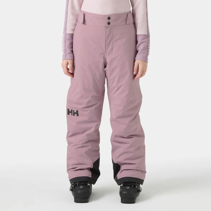 Pantalon de ski violet clair avec boutons noirs et logo HH sur la cuisse gauche, matière imperméable, porté de face sur mannequin enfant