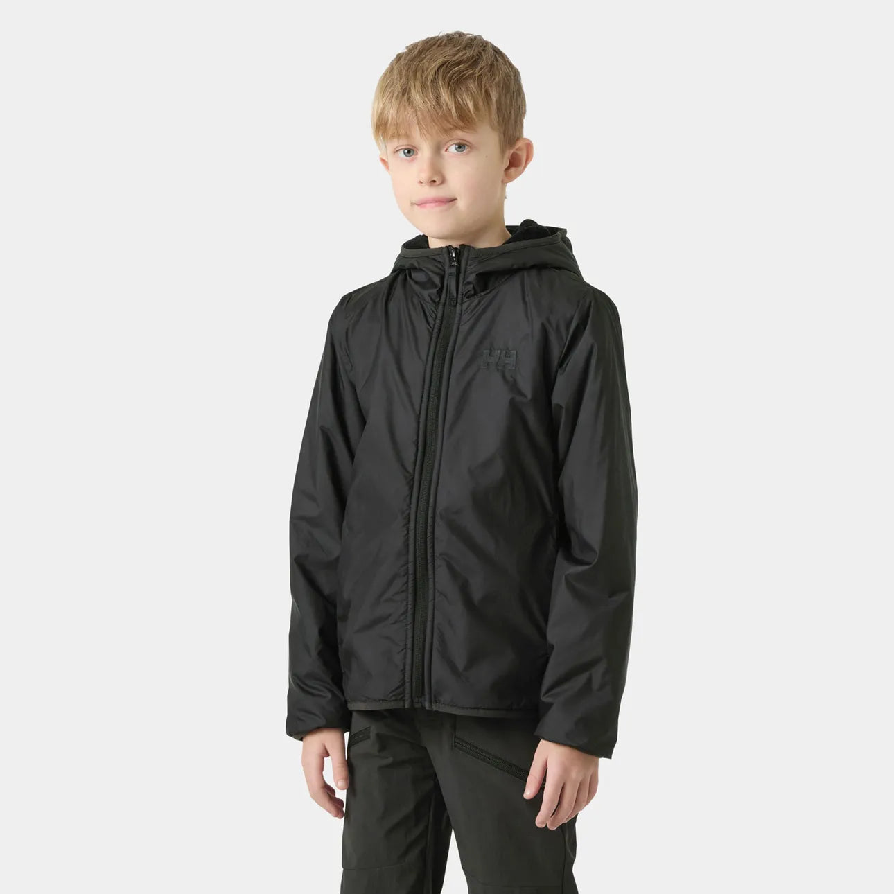 Manteau Mi-Saison - Helly Hansen noir avec capuche, coupe droite, tissu imperméable léger, pour garçon, porté sur mannequin, vue de face.