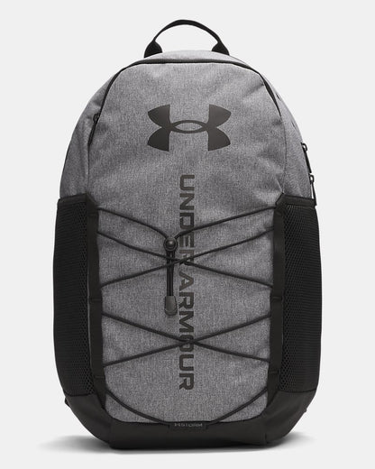 Sac à dos UA Hustle Sport 6.0 - Under Armour (Copie) gris chiné avec détails noirs, style sportif, tissu résistant, vue de face.