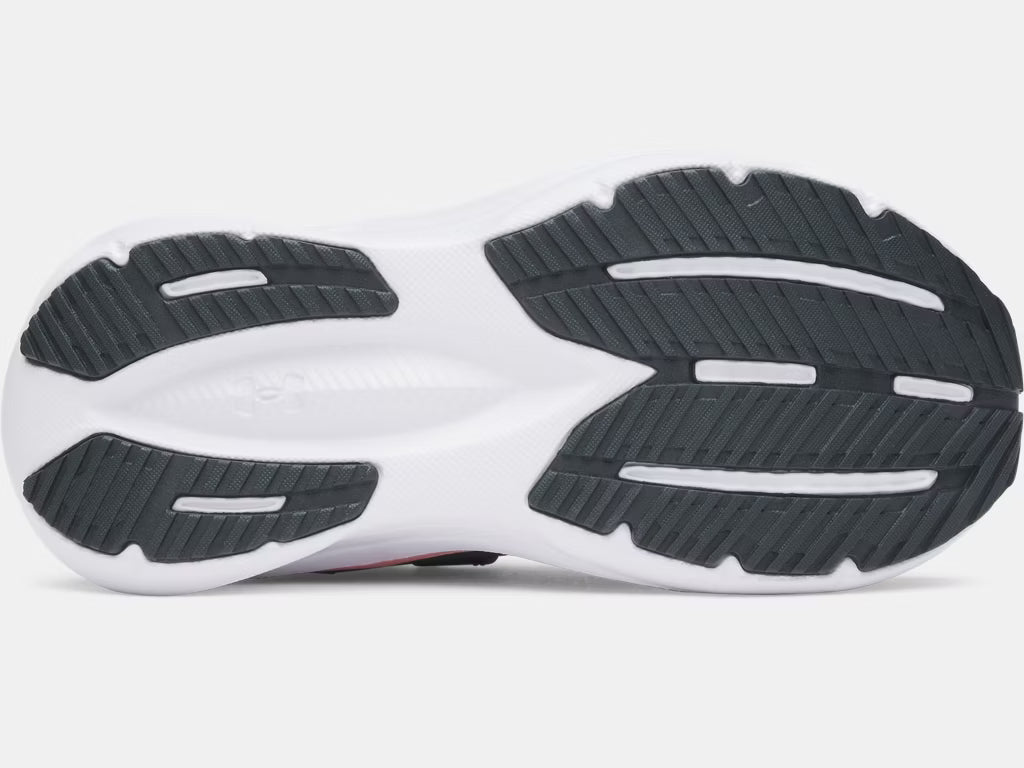 Semelle extérieure noire et blanche avec détails en caoutchouc de traction pour Espadrilles UA Charged+ Assert 11 - Under Armour, vue de dessous.