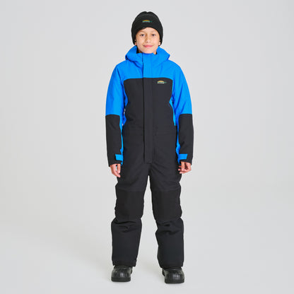Enfant portant un Habit de neige 1 Pièce - Chlorophylle bleu et noir en tissu technique, combinaison de ski une pièce, vue de face.