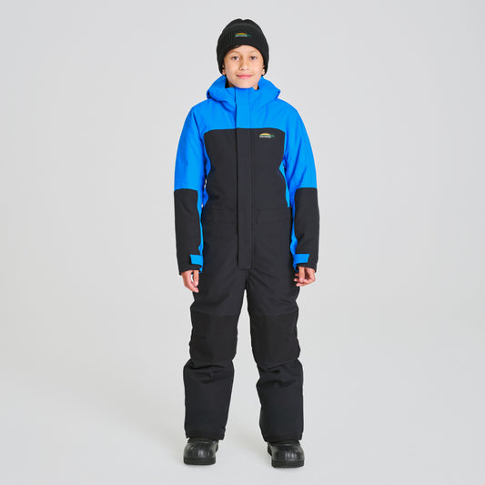 Enfant portant un Habit de neige 1 Pièce - Chlorophylle bleu et noir en tissu technique, combinaison de ski une pièce, vue de face.