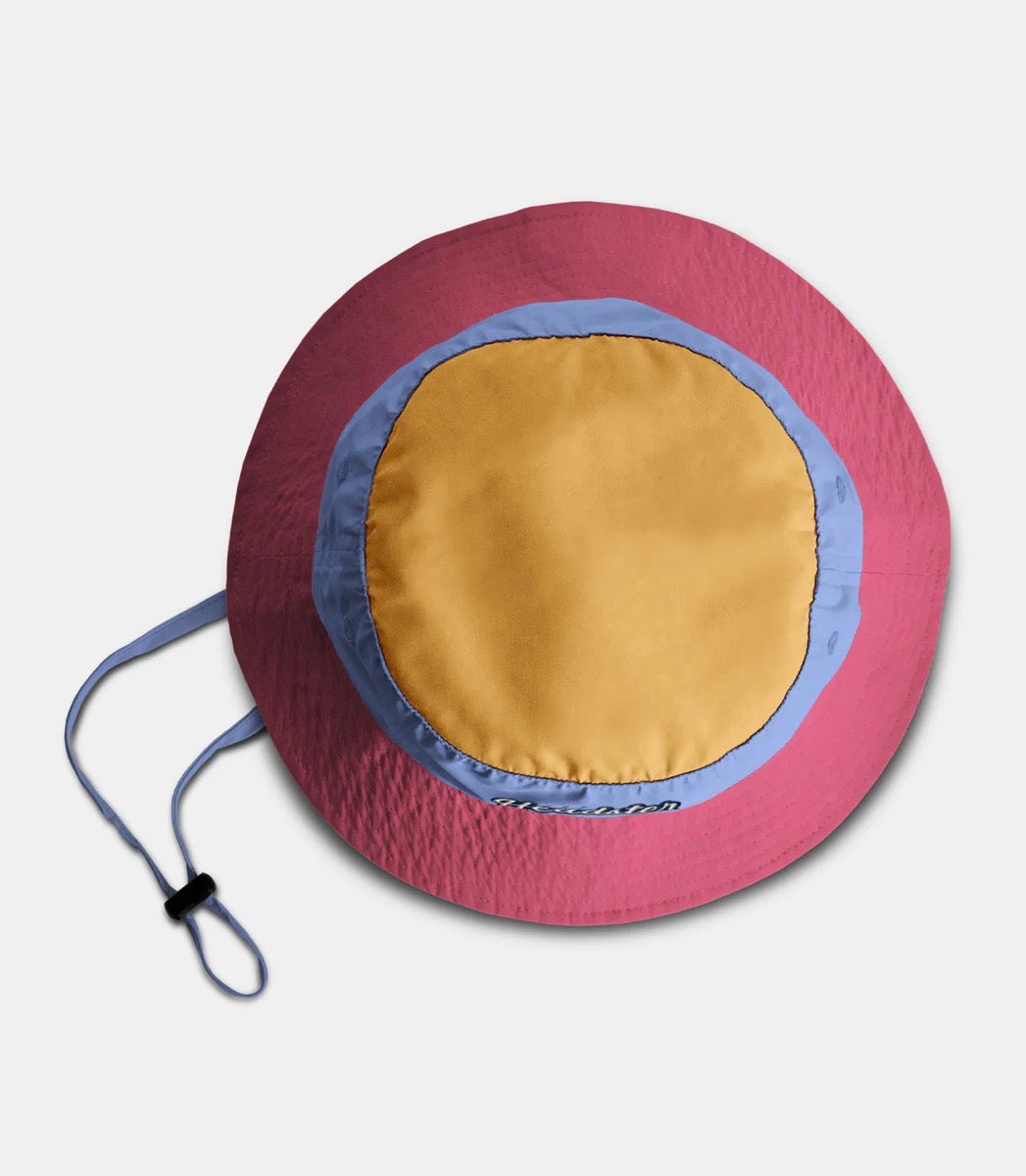Chapeau Lakeshore Nylon - Headster en nylon rose, bleu et jaune, style bob enfant, vue de dessus avec cordon de serrage.