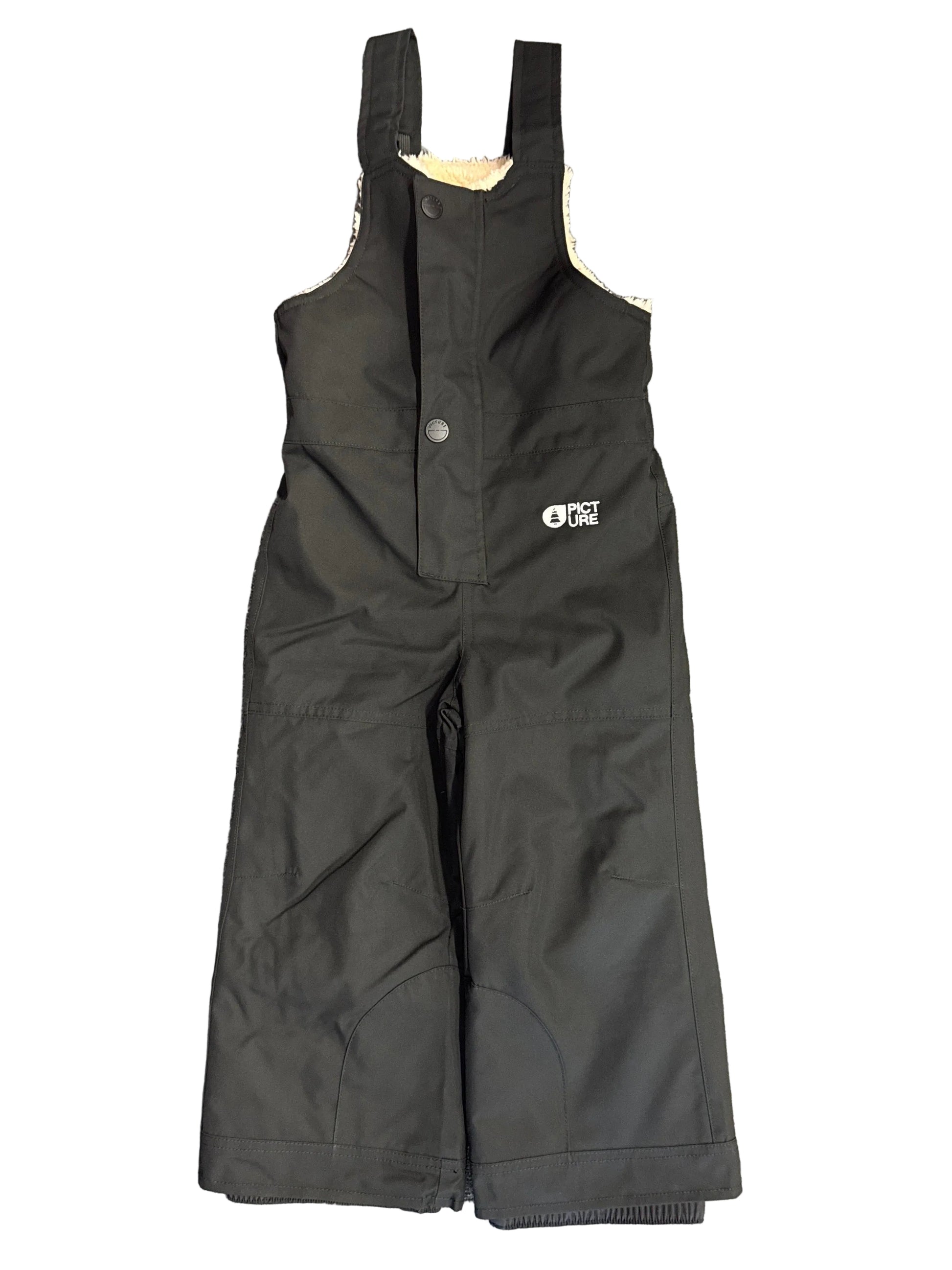 Salopette de neige SNOWY - Picture Organic Clothing noire en tissu imperméable avec doublure claire, pour enfant, vue de face sur fond blanc.