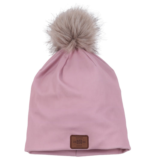 Tuque Mi-Saison - Nanö rose pâle avec pompon en fausse fourrure beige clair, en tissu doux, vue de face.