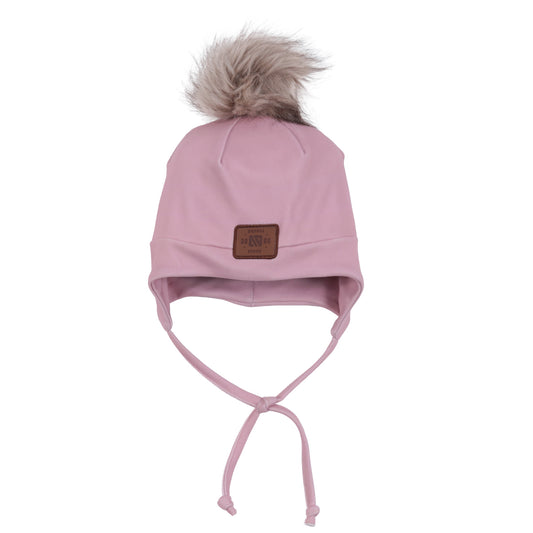 Tuque Mi-Saison - Nanö rose pâle en tissu doux avec doublure, pompon en fausse fourrure, liens sous le menton, pour enfant, vue de face.