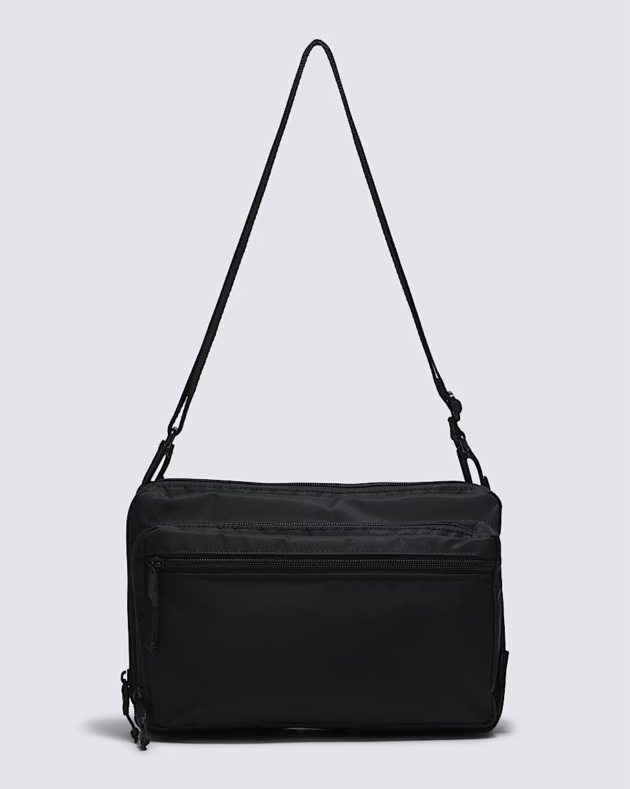 Sac à bandoulière - Vans noir en tissu synthétique résistant avec poche zippée, style unisexe, vue de face.