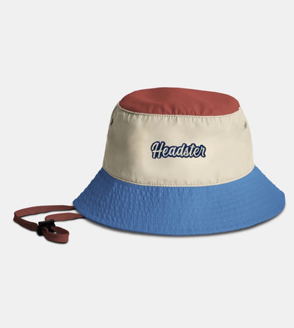 Chapeau Lakeshore Nylon - Headster bicolore rouge, beige et bleu en nylon avec sangle réglable, vue de côté.