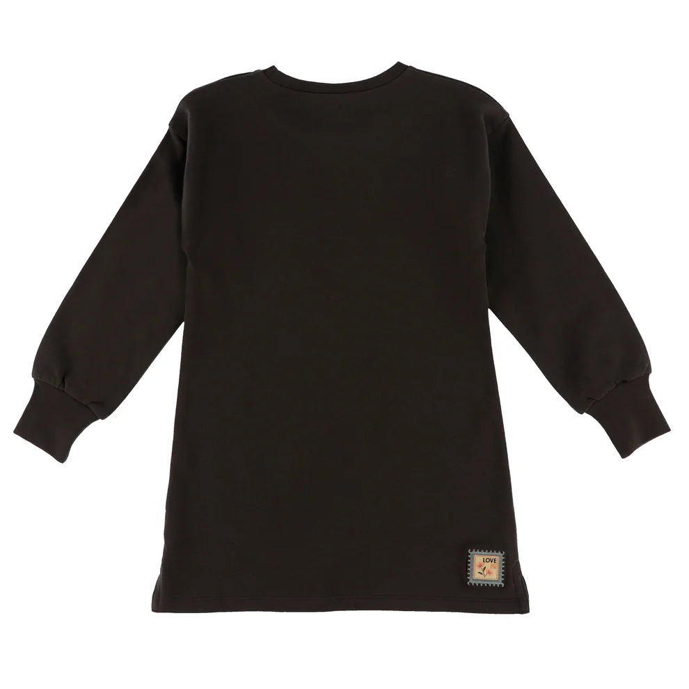 Tunique - Nanö noire en coton avec manches longues et col rond, pour enfant, vue de dos avec étiquette cousue près de l'ourlet.