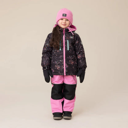 Habit de neige Melody - Nanö noir avec motifs roses et détails turquoise, pantalon rose et noir, porté par enfant fille, vue de face.