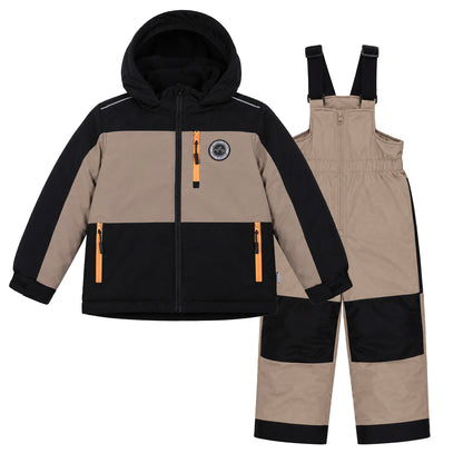 Habit de neige - Peluche & Tartine beige et noir en textile technique, veste à capuche avec poches zippées, pantalon à bretelles, pour enfant, vue de face.