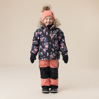 Habit de neige - Peluche & Tartine pour enfant fille, veste noire à motifs floraux roses avec capuche fourrure, pantalon saumon et noir, vue de face.
