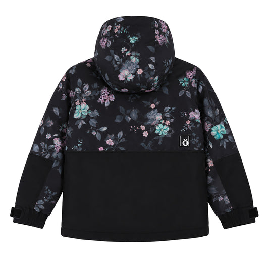 Manteau - Snö pour enfant, vue de dos, motif floral violet et vert sur fond noir avec capuche, partie inférieure unie noire en tissu technique.