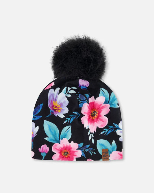Tuque Mi-Saison - Deux Par Deux noire à fleurs roses, bleues et violettes avec pompon noir flottant vue de face enfant