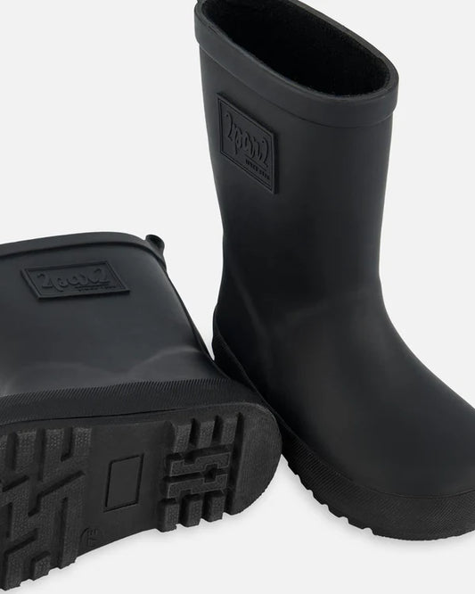 Bottes de pluie - Deux Par Deux noires en caoutchouc naturel pour enfant, vue de côté et dessous de semelle visible.