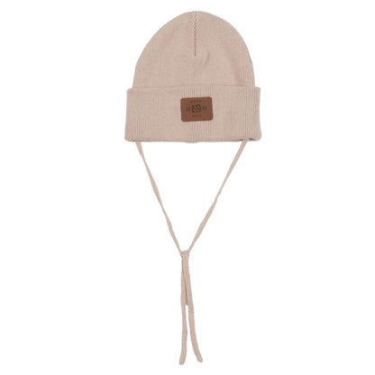 Tuque Mi-Saison - Nanö beige en tricot avec liens à nouer, détail étiquette en cuir, pour enfant, vue de face.