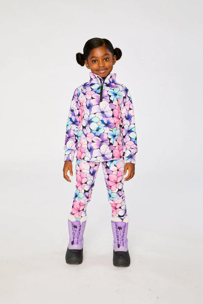 Sous-vêtements thermiques - Deux Par Deux à motif floral multicolore roses, violets et bleus, en tissu chaud, pour enfant, porté de face.