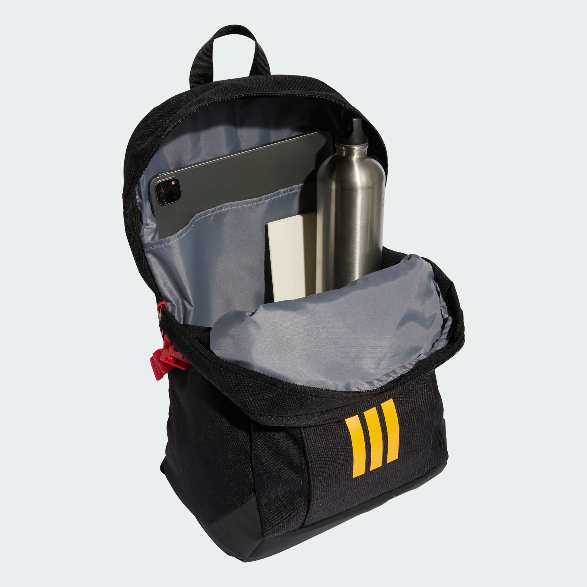 Sac à dos ADIDAS APWR - Adidas noir et jaune avec compartiments intérieurs, vue ouverte et remplie d’objets, style sportif.