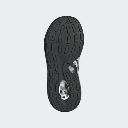 Semelle noire avec motifs antidérapants, détails argentés, vue de dessous des Espadrilles Lite Racer Adapt 8.0 K - Adidas.