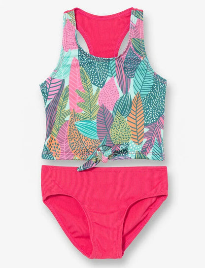 Maillot de bain - M.I.D. deux pièces bébé fille avec haut à motifs feuilles multicolores et bas rose fuchsia, vue de face