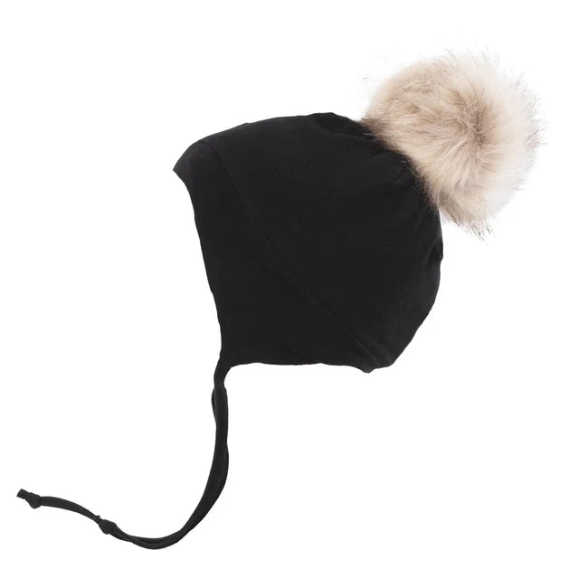 Tuque d'hiver - Nanö noire avec pompon beige et couvre-oreilles noués pour enfant vue de dessus
