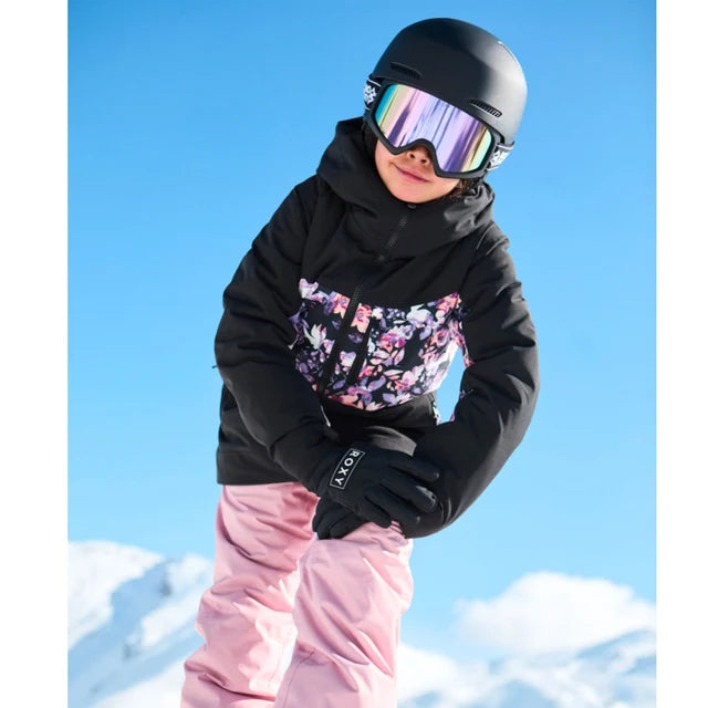 Manteau d'hiver - Roxy noir à empiècement fleuri, porté par une enfant en tenue de ski, vue de face