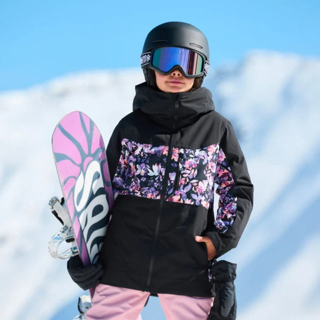 Manteau d'hiver - Roxy noir à motifs floraux colorés porté par un enfant en snowboard vue de face en montagne enneigée
