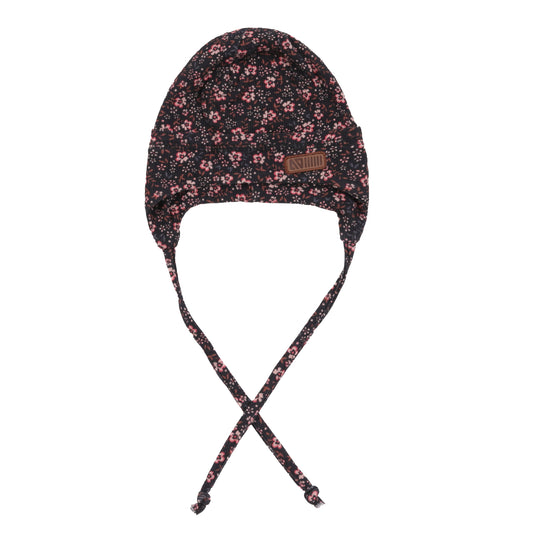 Tuque Mi-Saison - Nanö noire imprimé floral rose avec cordons et écusson simili cuir, vue de face pour enfant