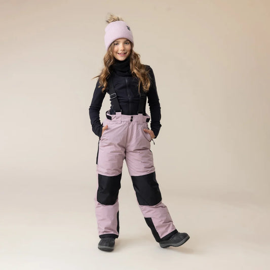 Salopette de neige - Snö rose pâle et noire pour fille vue de face avec bretelles ajustables et jambes renforcées