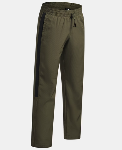 Pantalon UA Rival Woven - Under Armour vert olive avec bande noire latérale, style sportif, tissu tissé, vue de face.