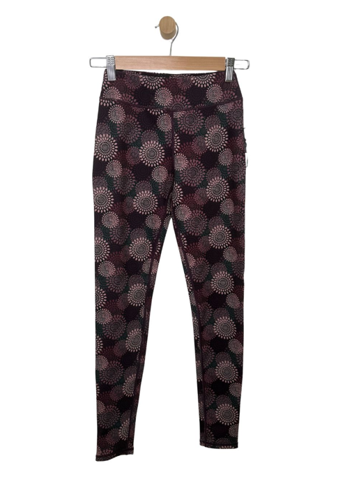 Legging - M.I.D noir et bordeaux à motifs circulaires imprimés présenté de face sur cintre
