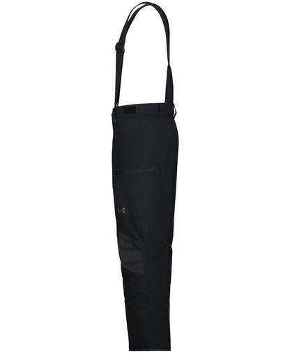 Salopette de neige - Under Armour noire à bretelles réglables, poche zippée et coupe droite, vue de face en plein pied