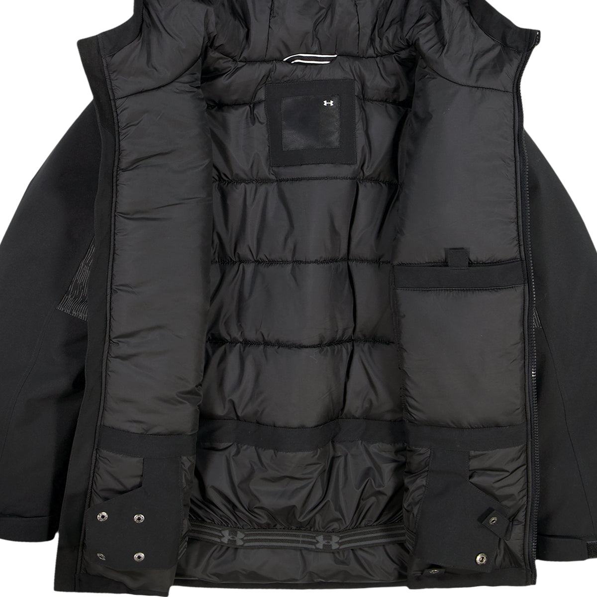 Manteau d'hiver - Under Armour noir ouvert montrant la doublure matelassée les poches intérieures et la fermeture éclair