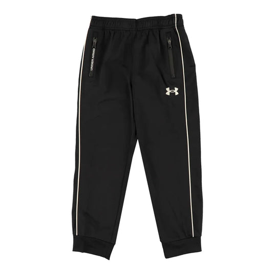 Pantalon - Under Armour noir avec bandes blanches latérales, poches zippées, tissu technique, pour enfant, vue de face.